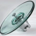 Aerodynamic glass insulator with open profile design for desert transmission lines and dust contamination control